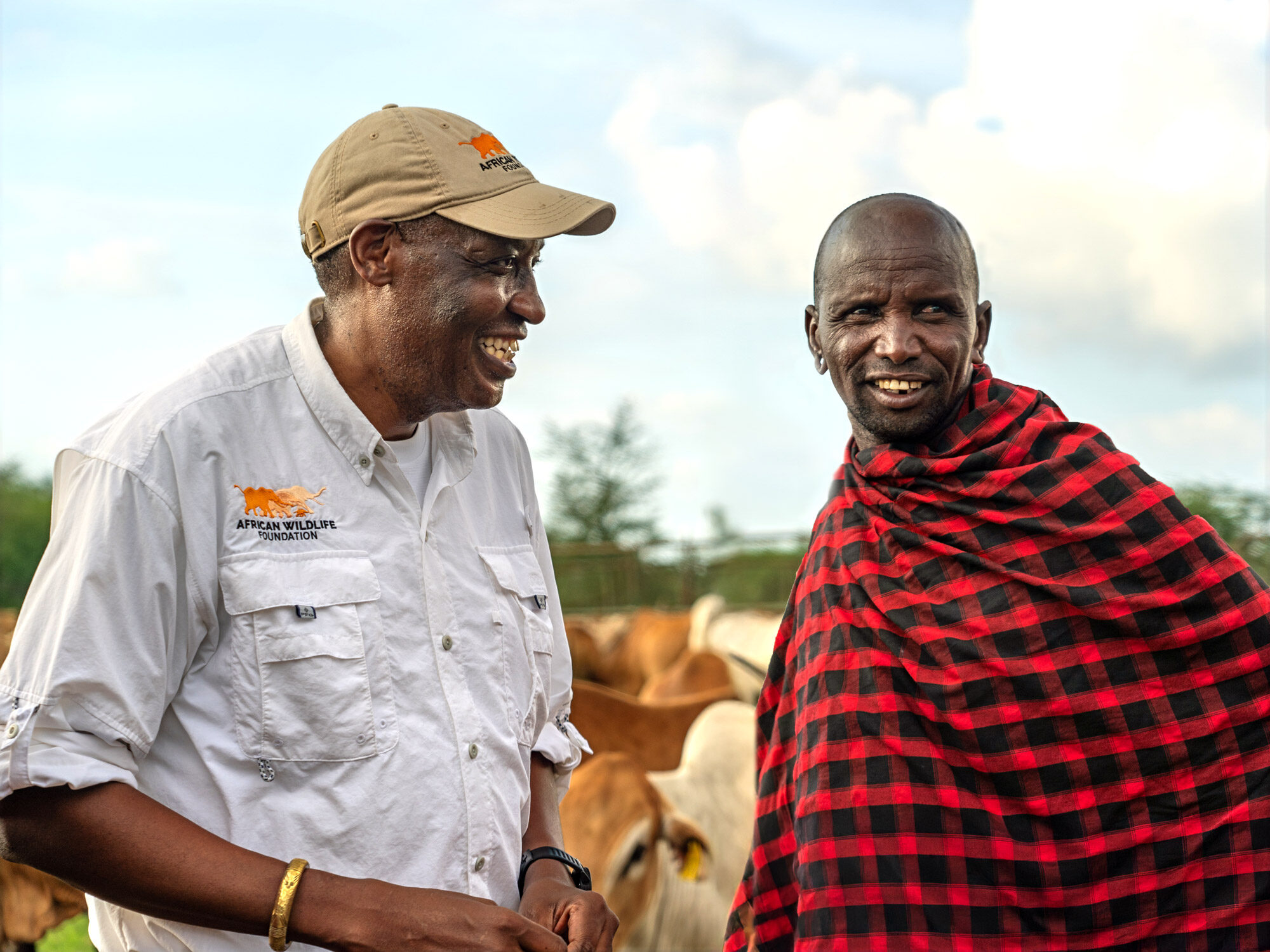AWF CEO Kaddu Sebunya meets with a cattle rancher.